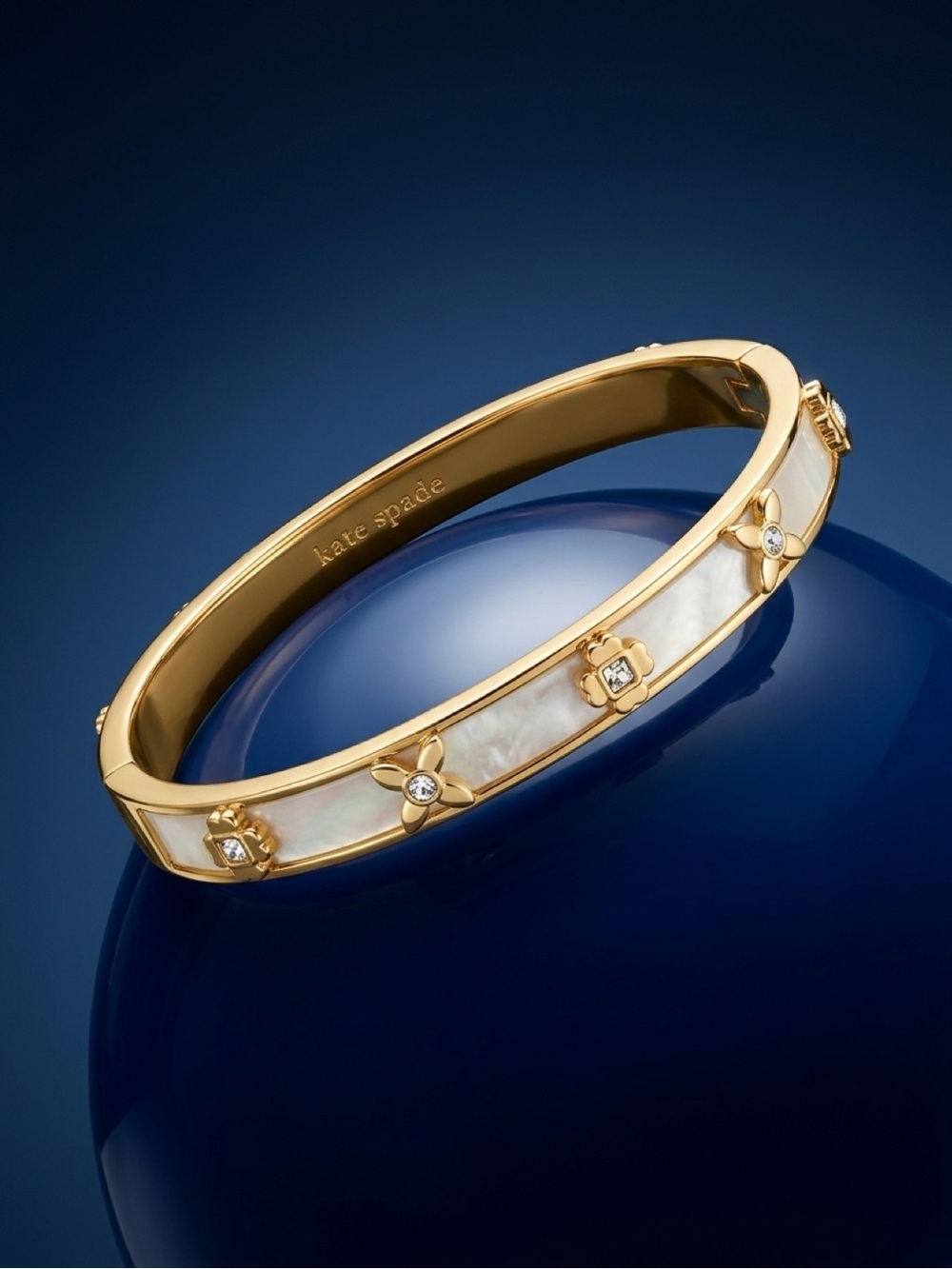 kate spade Gold-tone Bangle with Pearlescent White Floral Accents